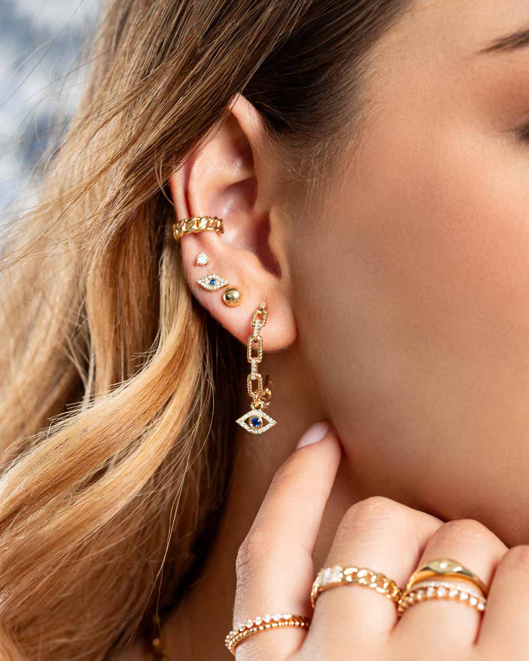 D0.10CT 14KY EVIL EYES EARRINGS BS0.06CT