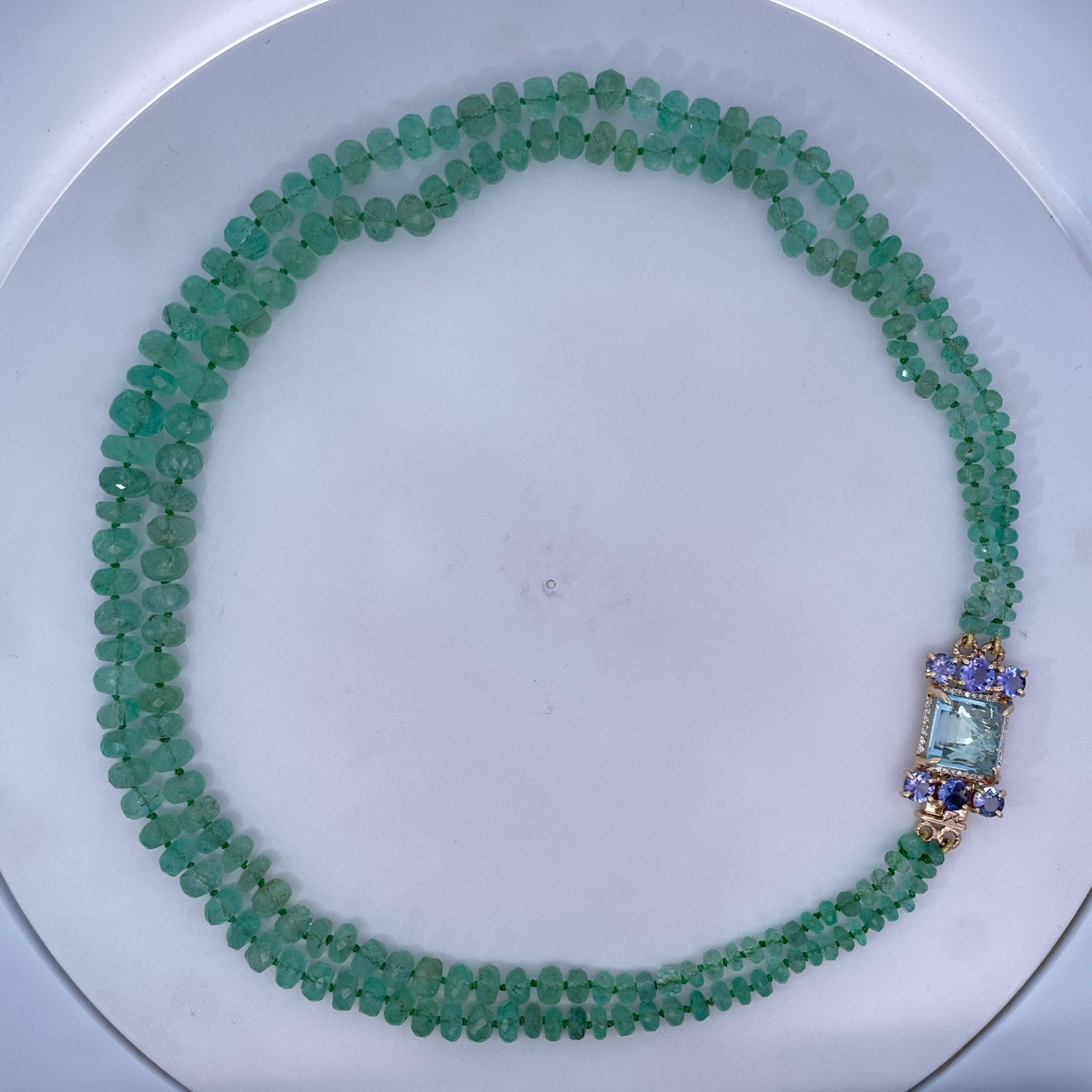D0.16CT 14KY EMERALD BEAD NECKLACE 245CT LIGHT BLUE TOPAZ 9.5CT AND TANZANITES 2CT - C'SANTOS