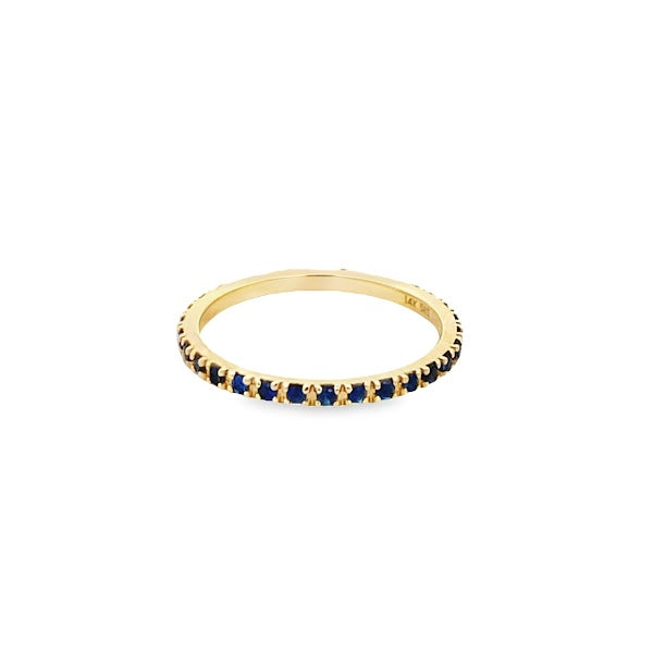 BLUE SAPPHIRE ETERNITY RING SET IN 14K YELLOW STONE