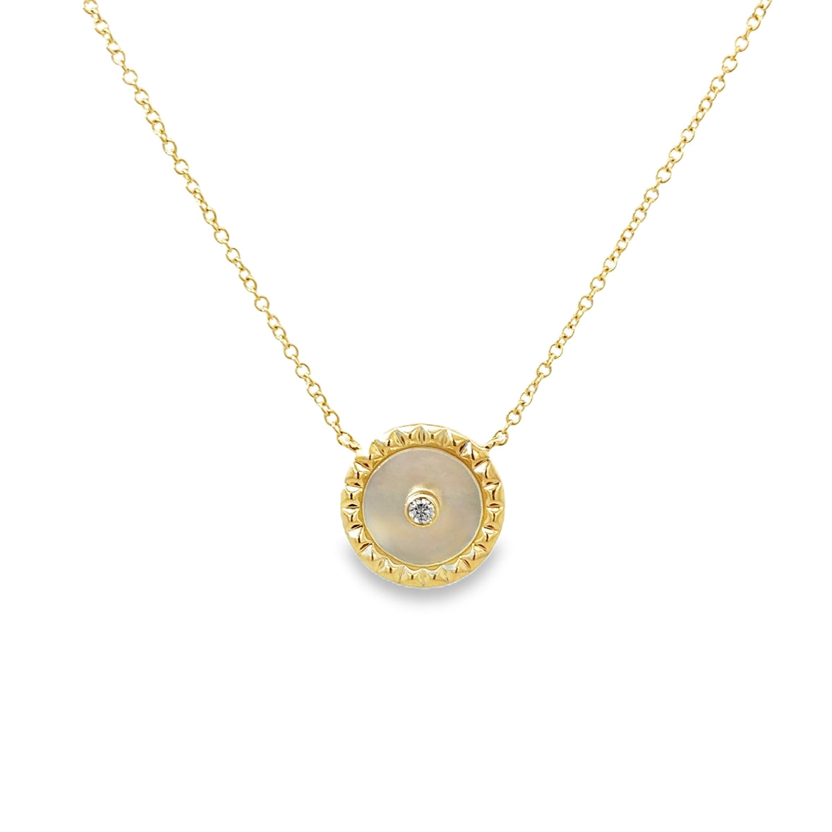 MOTHER OF PEARL COIN WITH DIAMOND ACCENT SET IN 14K YELLOW GOLD