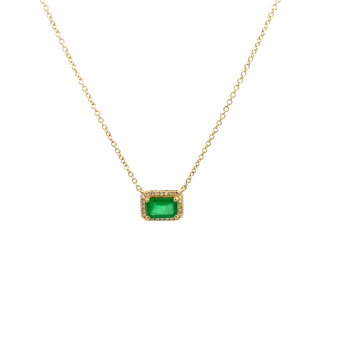 EMERALD BAGUETTE WITH DIAMOND HALO SET IN 14K YELLOW GOLD