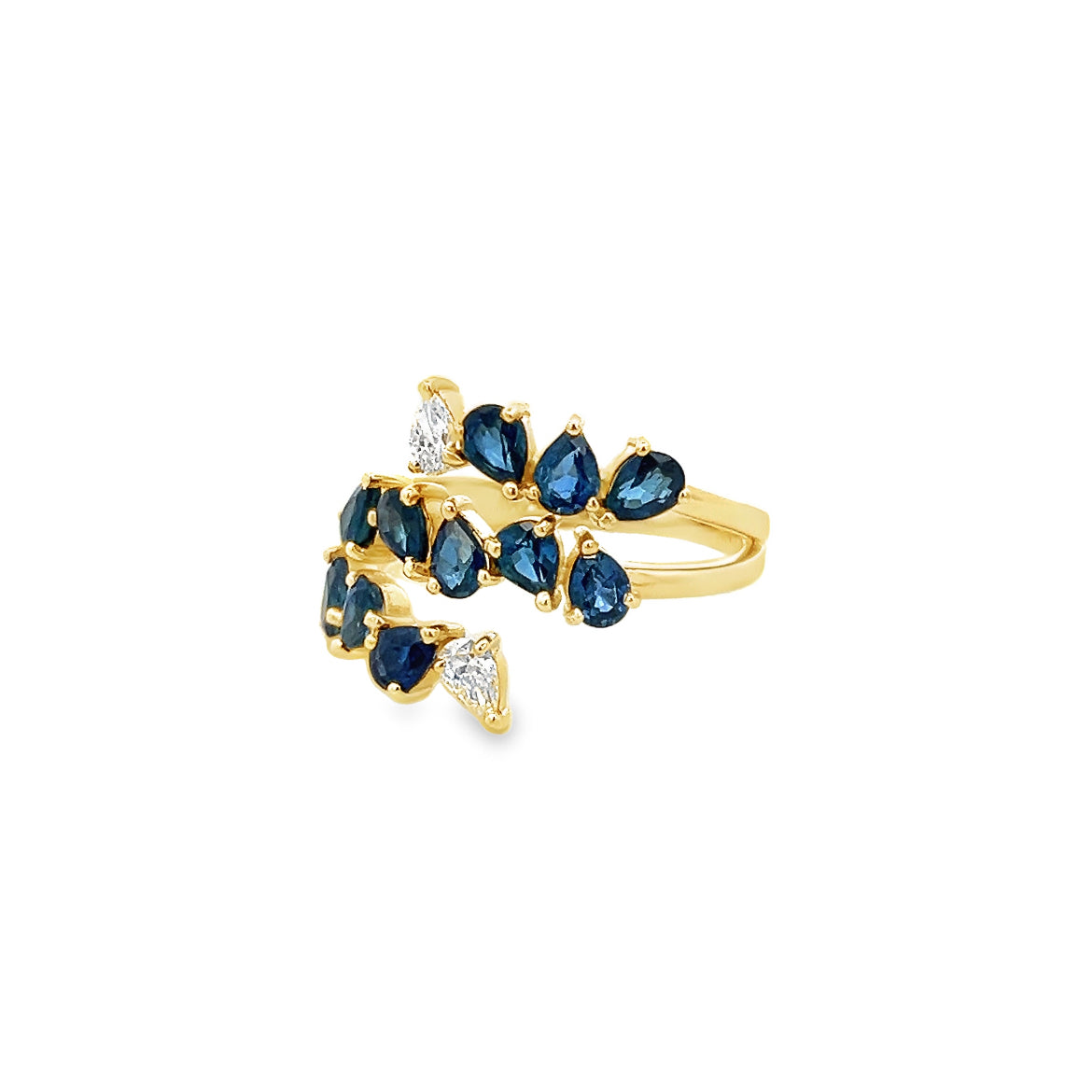 PEAR CUT BLUE SAPPHIRES AND DIAMONDS BYPASS RING SET IN 18K YELLOW GOLD.