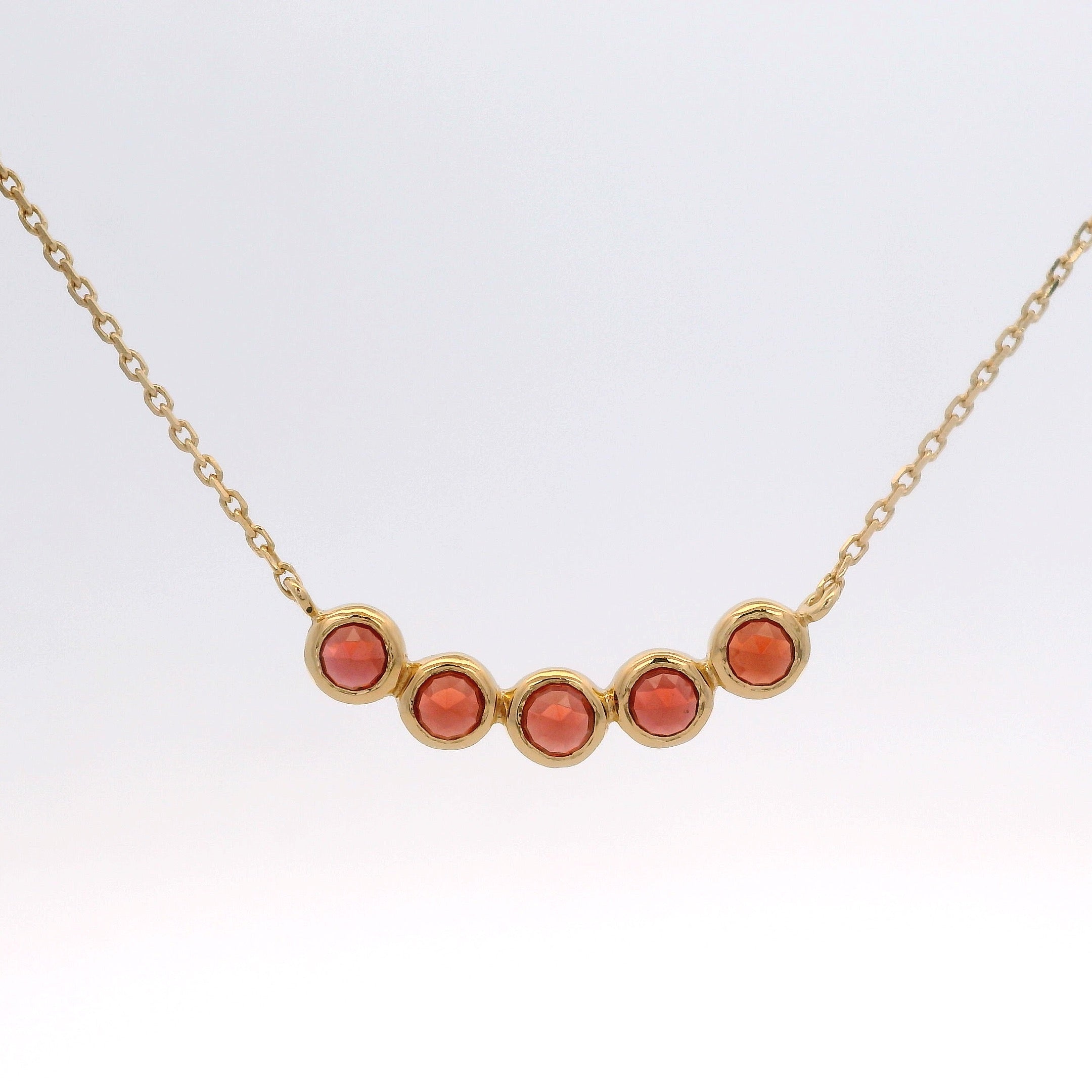 925YG BAR CURV 5 STONE BEZEL GARNET NECKLACE