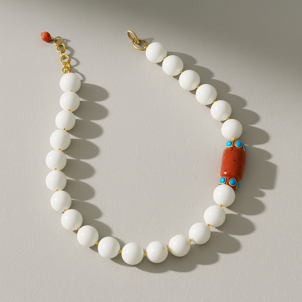 NECKLACE SINGLE STRAND OF WHITE ROUND AGATE WITH ONE ORANGE CORAL STATION AND TURQOUISE SET RONDELLE