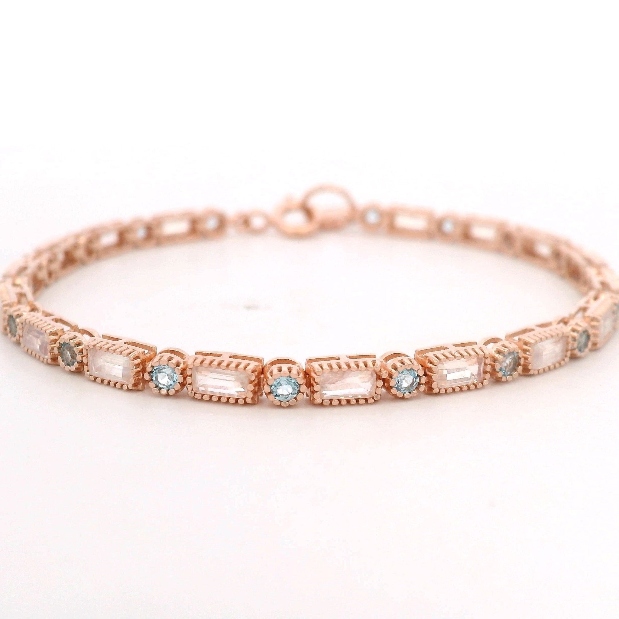 925RG TENNIS BAGUETTE MOOSTONE BEZL TOPAZ BLUE BRACELET - C'SANTOS