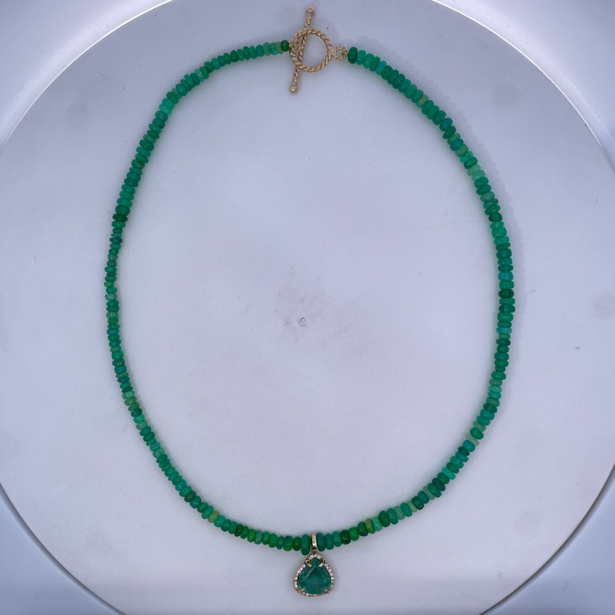 D0.12CT 14KY NECKLACE EMERALDS AND EMERALD 2CT HALO CHARM - C'SANTOS